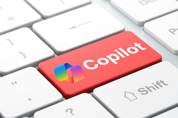 Close-up of a keyboard featuring a red key with 'Copilot' in white text next to its logo.
