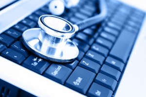 Close up of a keyboard with a stethoscope resting on the left side