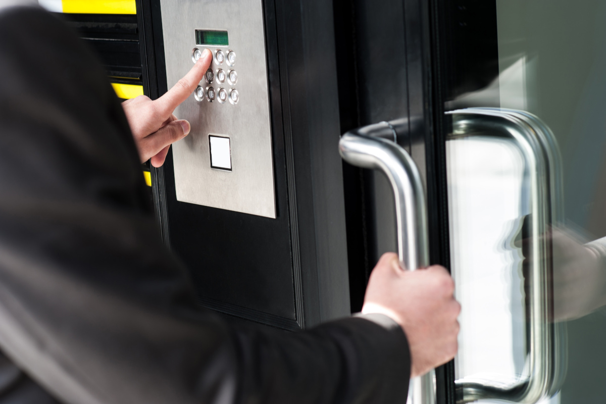 Someone attempting to unlock a door that has access control security