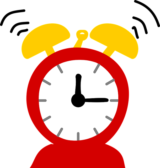 Red and yellow depiction of a ringing alarm clock with hands at 12:15