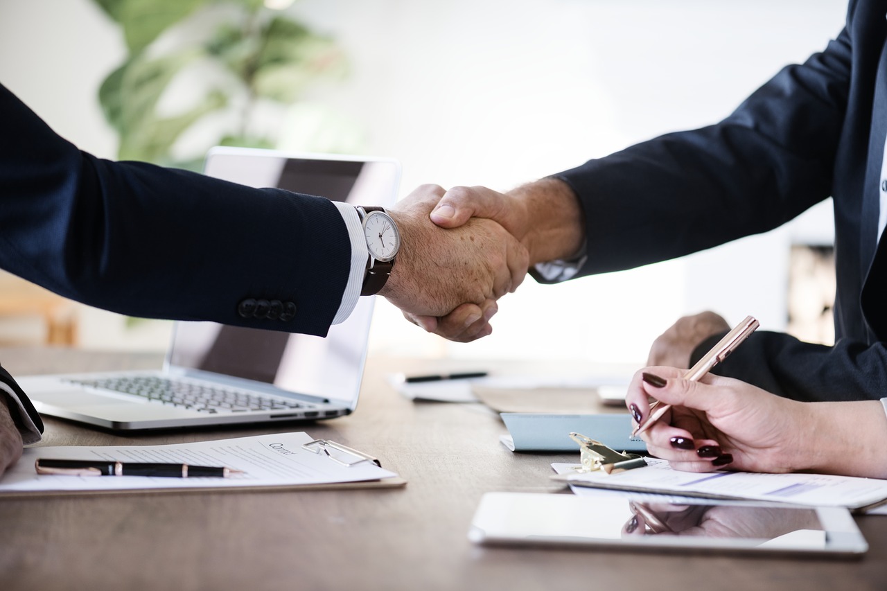 Close up of two businessman shaking hands