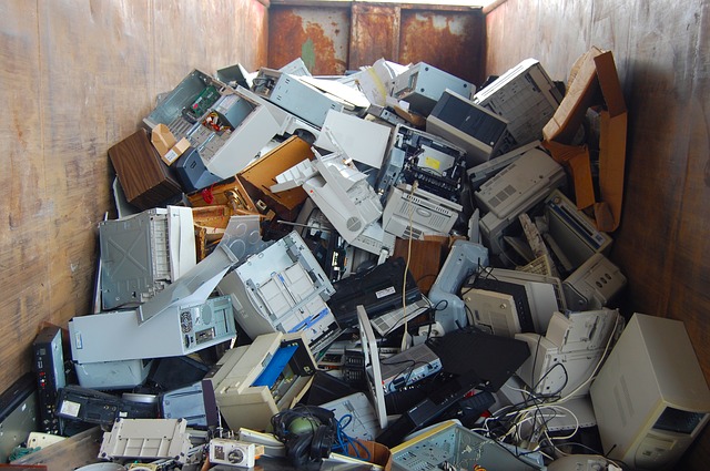 Pile of old computer parts in a metal shipping container