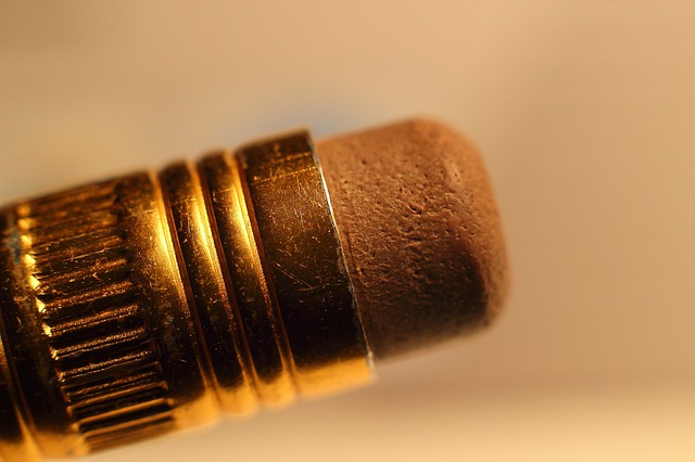 Sepia-tinted close up of an eraser on the back of a pencil