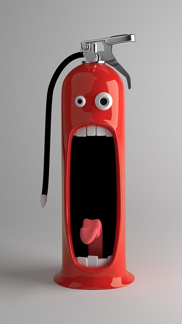 Shiny, red fire extinguisher with a yelling cartoon face on the side