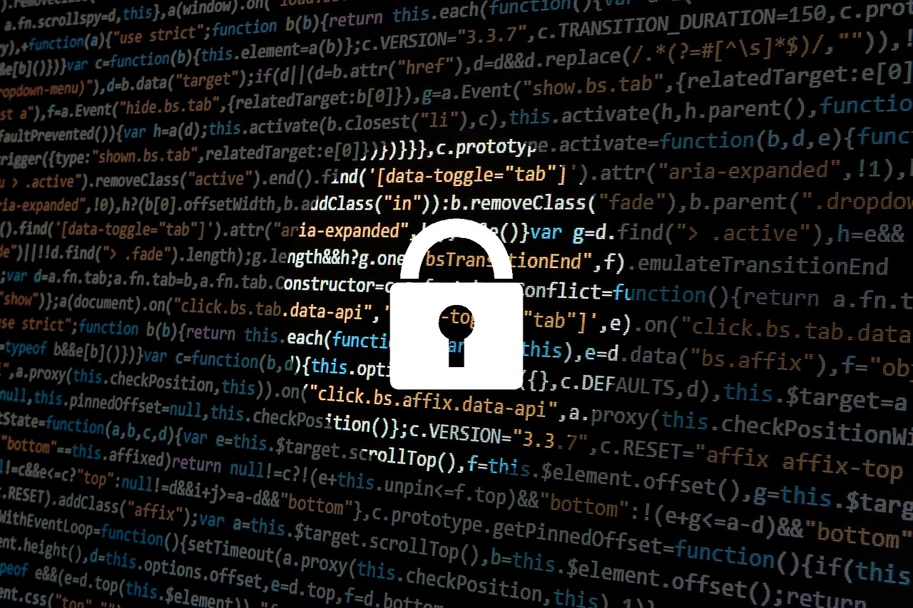 White security icon spotlighted on a dark field of colorized programming code