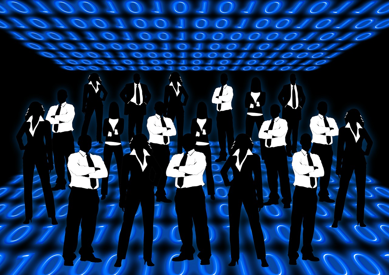Black and white silhouettes of businesspeople against a blue background of 1s and 0s