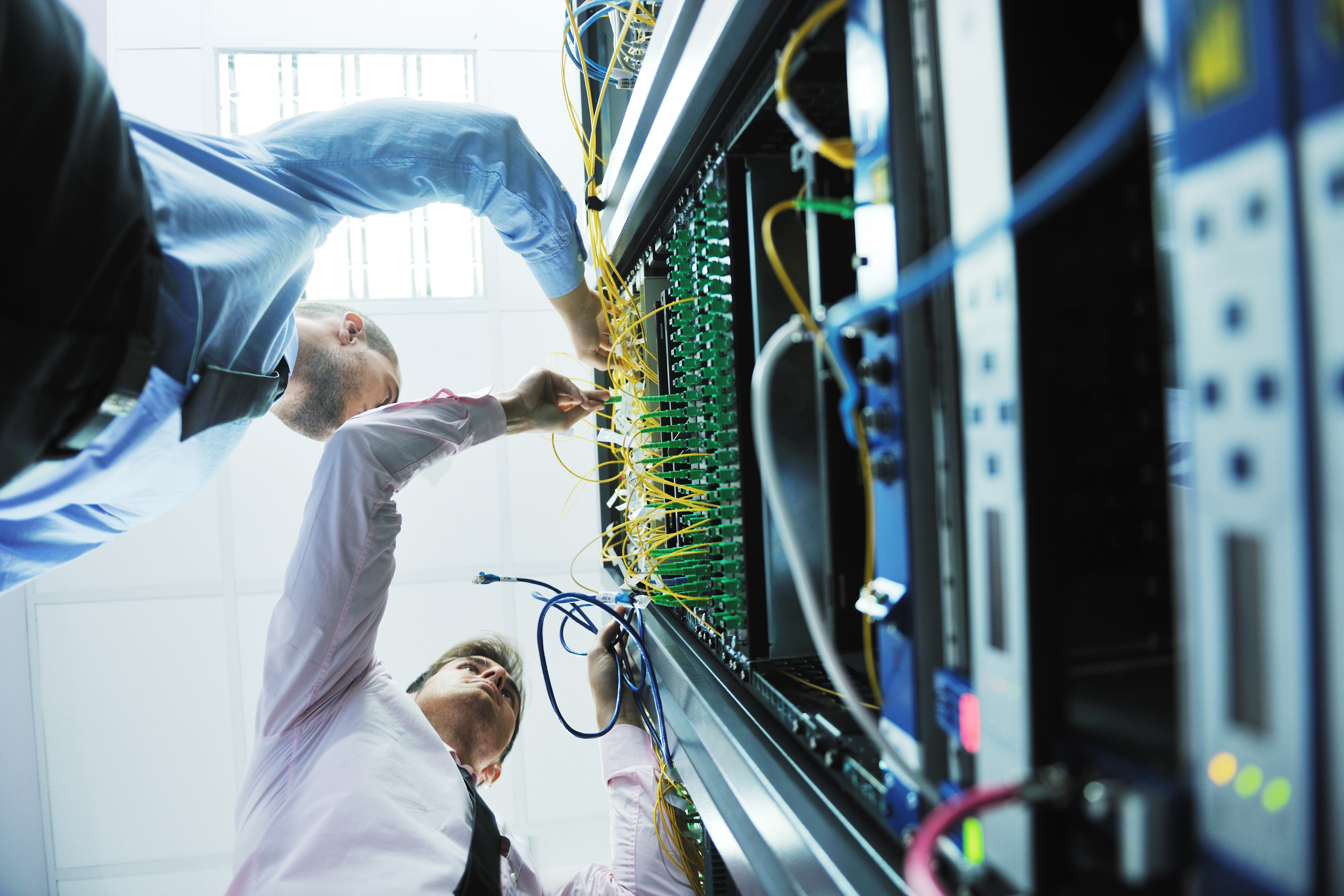 Technicians working on network servers