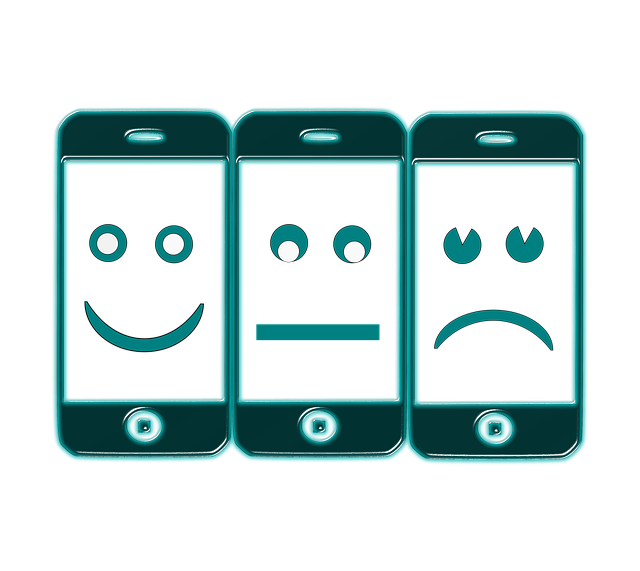 Three smartphones with happy, neutral, and sad faces on them