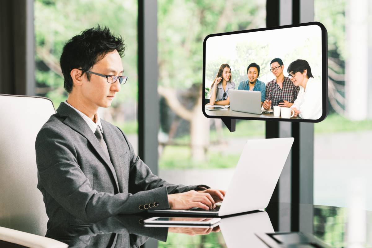 A businessman working remotely in his home office