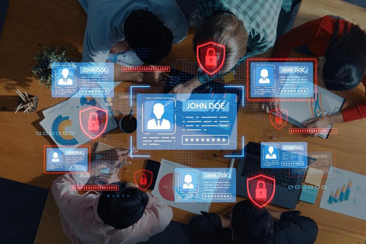 Top-down view of a team meeting with digital identity cards and padlocks overlaid