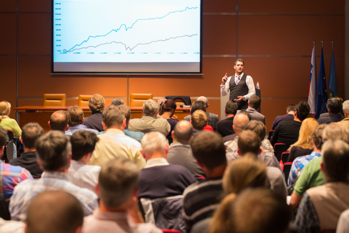 Speaker at Business Conference Presentation with Audience at Conference Hall