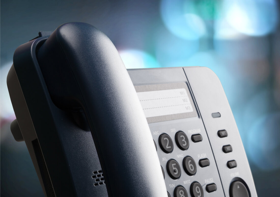 Close Up Image of VoIP Phone with Bokeh Background