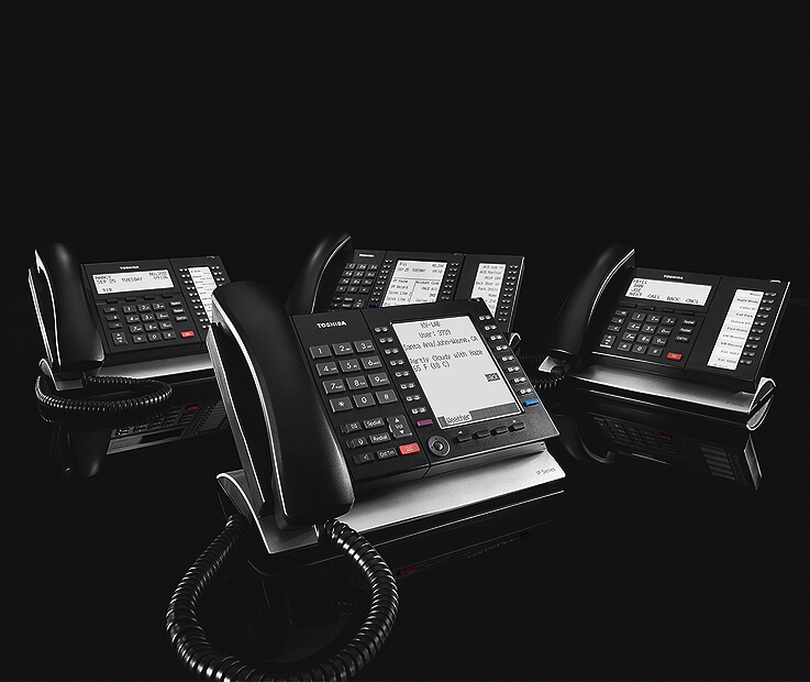 Toshiba CIX Family Phones on Reflective Black Background