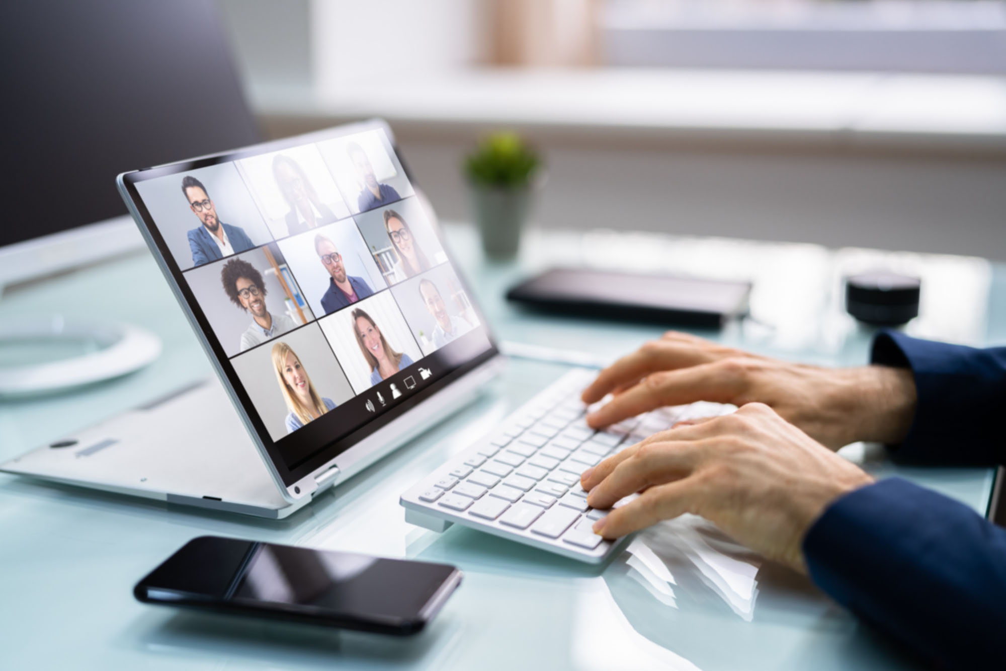A close up of a tablet laptop that is being used to for a video conference call
