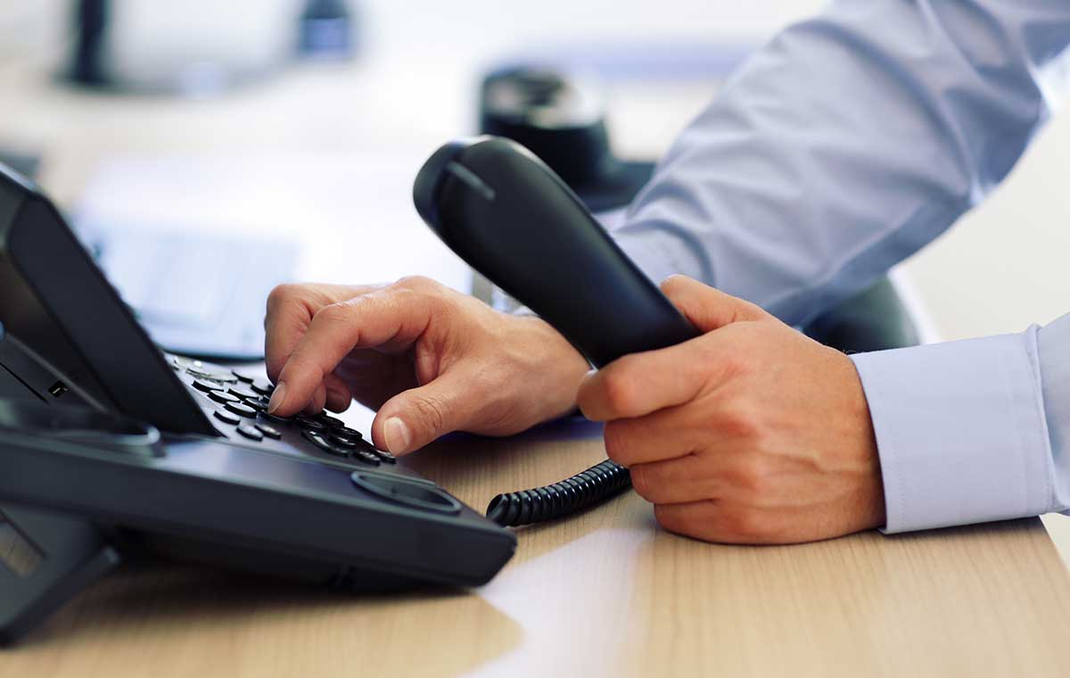 Business Phones and UCaaS with hands holding devices